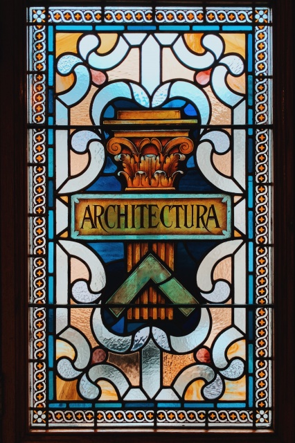 photo of a stained glass window with the word architectura in the center