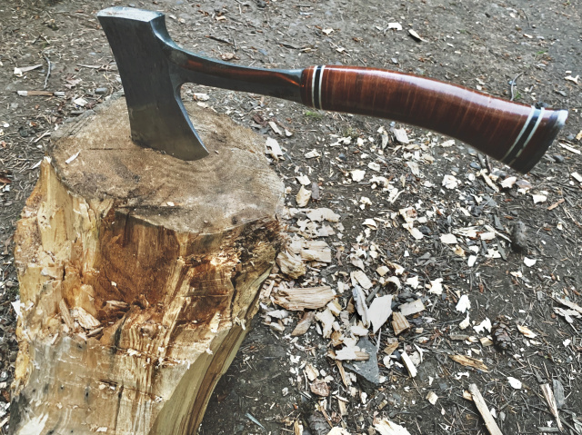 an axe stuck in a stump