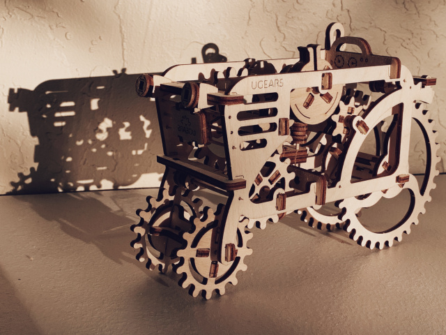 Wood model of a tractor in sunlight