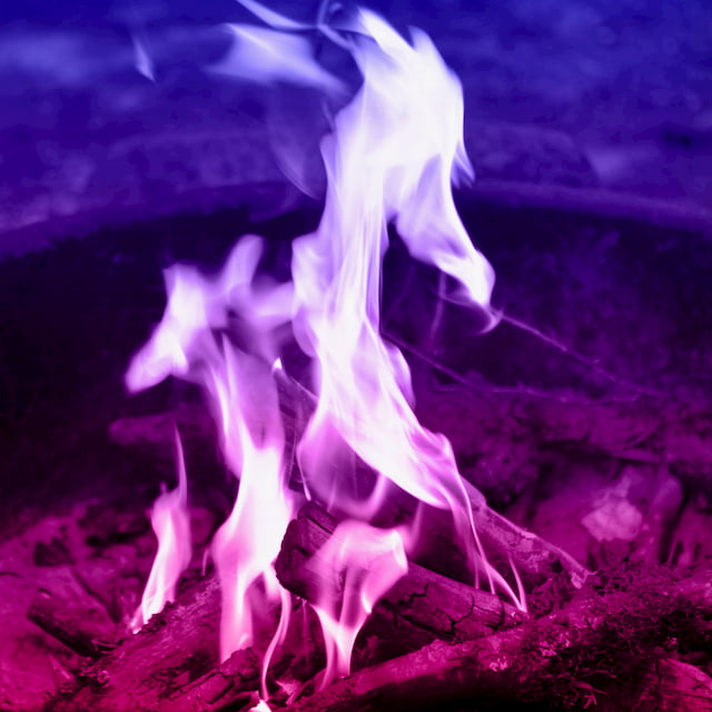 a campfire with colors from purple to red