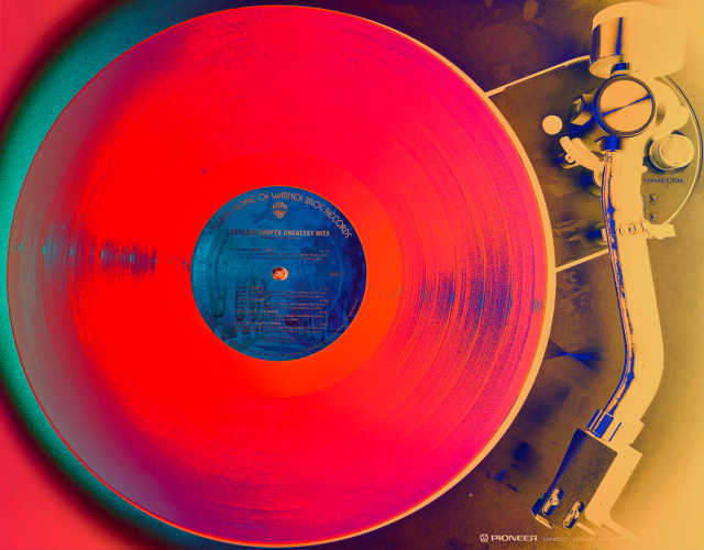 A record on a turntable with digitally altered colors